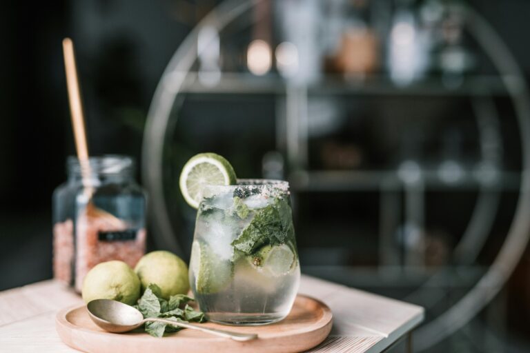 A beautifully styled mojito with fresh mint and limes, showcasing food photography at its best.